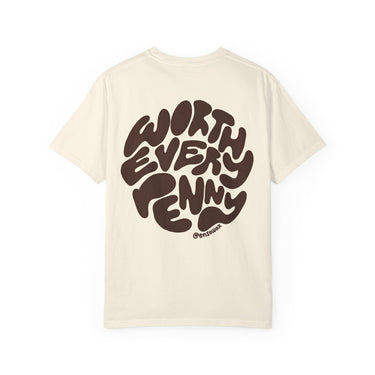 Off-white t-shirt by @ensowax featuring a large, bubbly brown circular graphic on the back with the text WORTH EVERY PENNY and the smaller artist handle @ensowax below, set against a clean white background